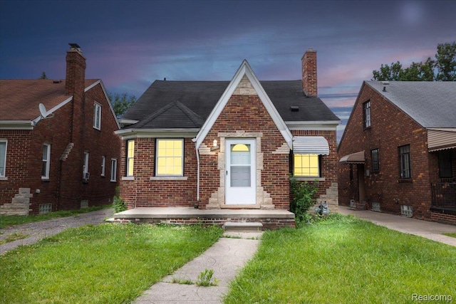 11110 Wayburn St, Grosse Pointe, MI 48224 - english style home featuring a lawn, brick siding, and a chimney