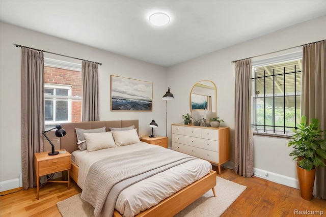11110 Wayburn St, Grosse Pointe, MI 48224 - bedroom with baseboards and light wood finished floors