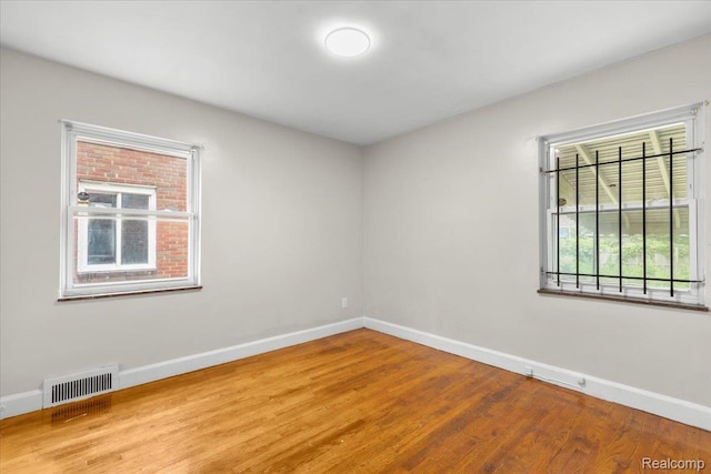 11110 Wayburn St, Grosse Pointe, MI 48224 - unfurnished room featuring baseboards and wood finished floors