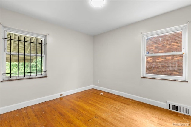 11110 Wayburn St, Grosse Pointe, MI 48224 - empty room with baseboards and wood finished floors