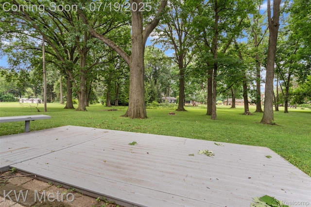 972 Goodale Ave, Clawson, MI 48017 - deck featuring a lawn and view of wooded area