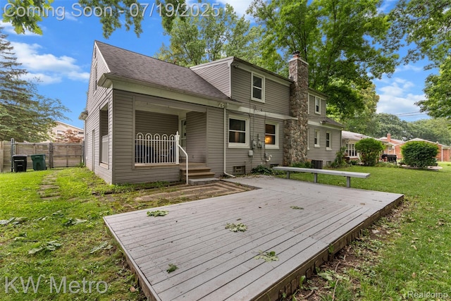 972 Goodale Ave, Clawson, MI 48017 - back of house featuring a chimney, a deck, and a shingled roof