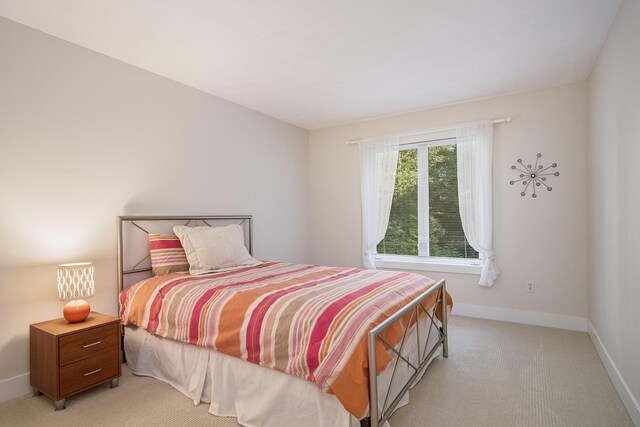 7751 Austinridge Dr SE, Caledonia, MI 49316 - bedroom with light carpet and baseboards