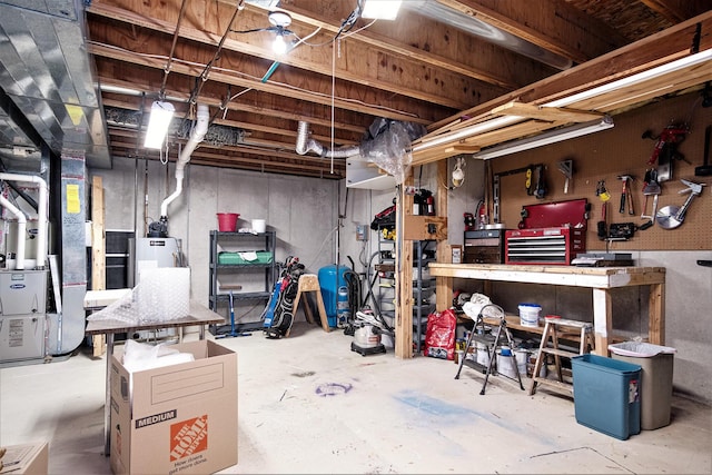 7751 Austinridge Dr SE, Caledonia, MI 49316 - unfinished basement featuring heating unit, a workshop area, and gas water heater