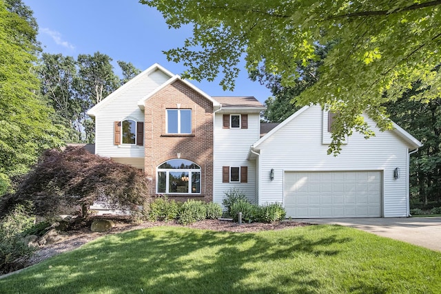 7751 Austinridge Dr SE, Caledonia, MI 49316 - traditional-style house with concrete driveway, a front yard, brick siding, and an attached garage