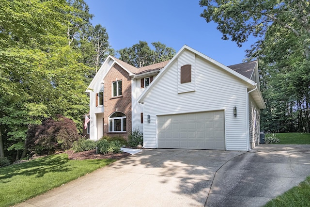 7751 Austinridge Dr SE, Caledonia, MI 49316 - traditional-style house featuring driveway