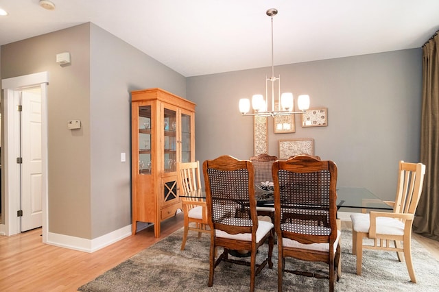 7751 Austinridge Dr SE, Caledonia, MI 49316 - dining space with a chandelier and light wood finished floors