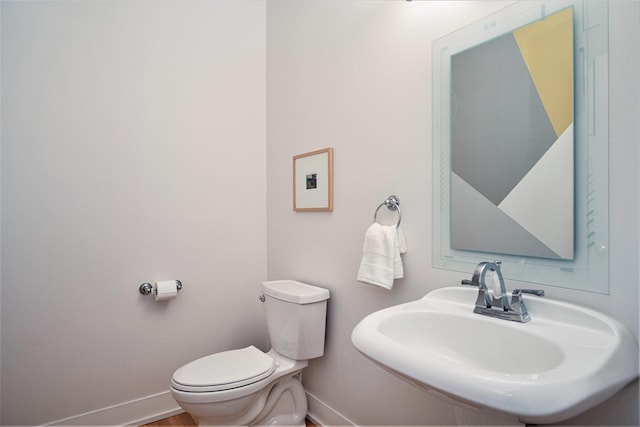 7751 Austinridge Dr SE, Caledonia, MI 49316 - bathroom with baseboards and a sink