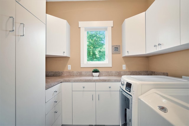 7751 Austinridge Dr SE, Caledonia, MI 49316 - kitchen featuring washing machine and clothes dryer, white cabinetry, and light countertops