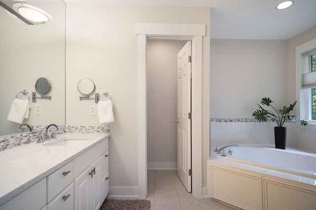 7751 Austinridge Dr SE, Caledonia, MI 49316 - full bath featuring vanity, a garden tub, tile patterned floors, and recessed lighting