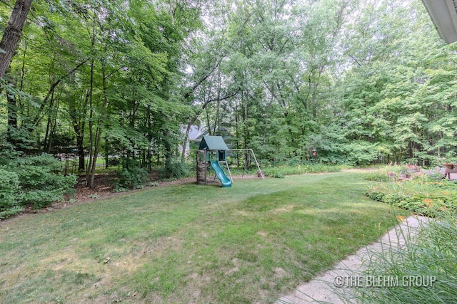 6340 Cannon Highlands Dr NE, Belmont, MI 49306 - view of grassy yard with a playground