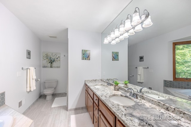 6340 Cannon Highlands Dr NE, Belmont, MI 49306 - full bathroom featuring double vanity and a garden tub