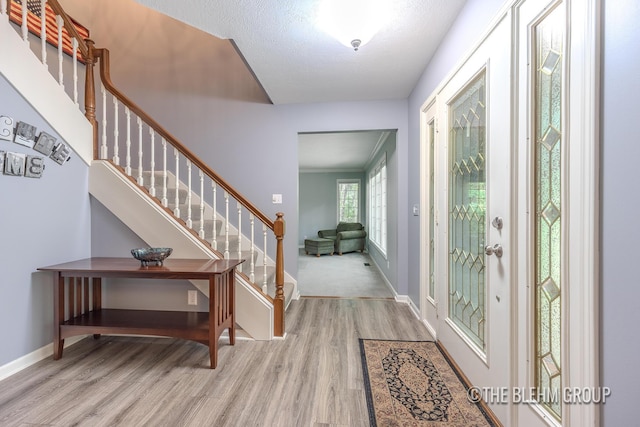6340 Cannon Highlands Dr NE, Belmont, MI 49306 - entrance foyer with wood finished floors and stairs