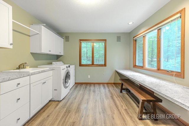 6340 Cannon Highlands Dr NE, Belmont, MI 49306 - laundry room featuring cabinet space, washing machine and clothes dryer, light wood-style floors, and recessed lighting