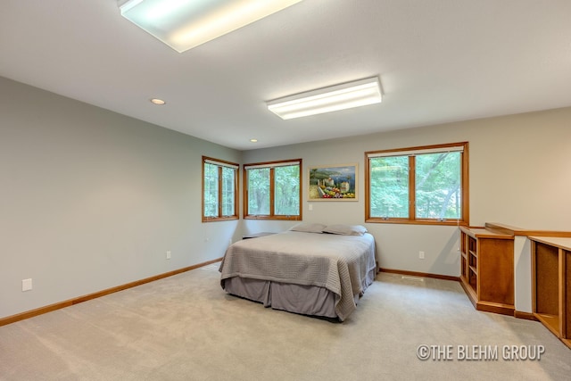 6340 Cannon Highlands Dr NE, Belmont, MI 49306 - bedroom featuring multiple windows, light carpet, and recessed lighting