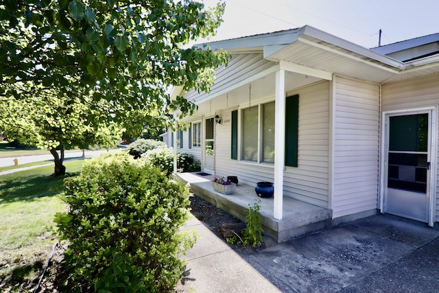 1340 Elmdale St NE, Grand Rapids, MI 49525 - view of side of property featuring covered porch and a yard