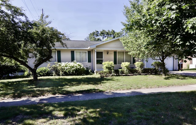 1340 Elmdale St NE, Grand Rapids, MI 49525 - view of front of home with a front yard and an attached garage