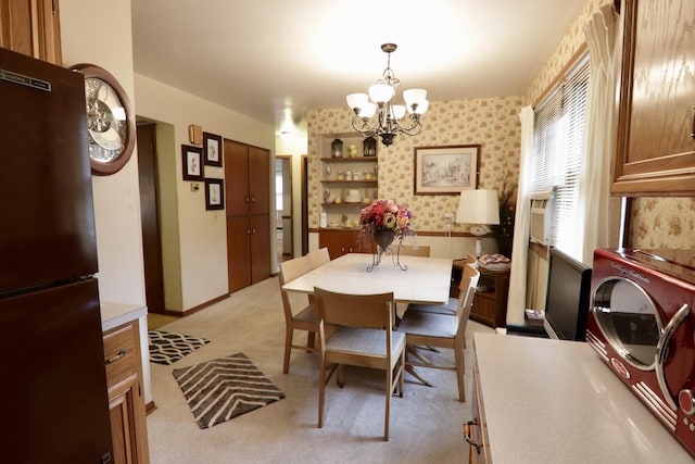 1340 Elmdale St NE, Grand Rapids, MI 49525 - dining area featuring a chandelier, light colored carpet, and wallpapered walls