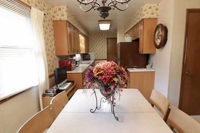 1340 Elmdale St NE, Grand Rapids, MI 49525 - dining space with wallpapered walls and a chandelier