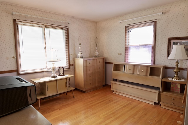 1340 Elmdale St NE, Grand Rapids, MI 49525 - living area with wallpapered walls and light wood-style flooring