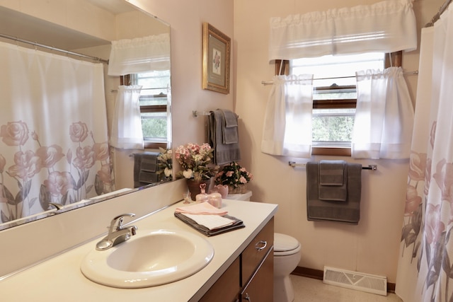 1340 Elmdale St NE, Grand Rapids, MI 49525 - bathroom featuring vanity, healthy amount of natural light, and curtained shower
