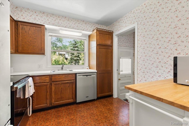 15588 Kirkshire Ave, Beverly Hills, MI 48025 - kitchen featuring dishwasher, electric range, wallpapered walls, brown cabinets, and butcher block counters