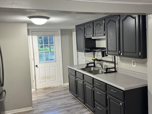 1230 Golden Ave, Battle Creek, MI 49014 - kitchen with light wood-type flooring and light countertops