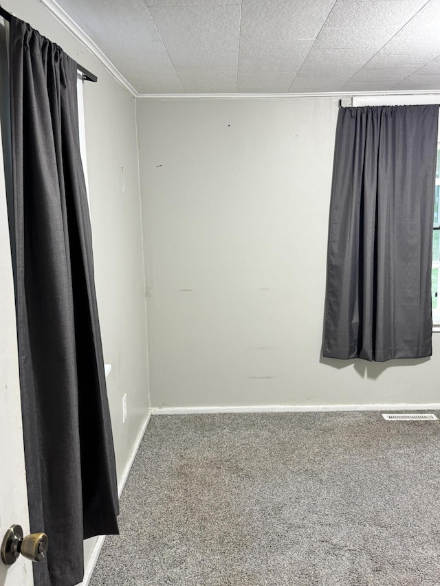 1230 Golden Ave, Battle Creek, MI 49014 - unfurnished room with carpet and crown molding