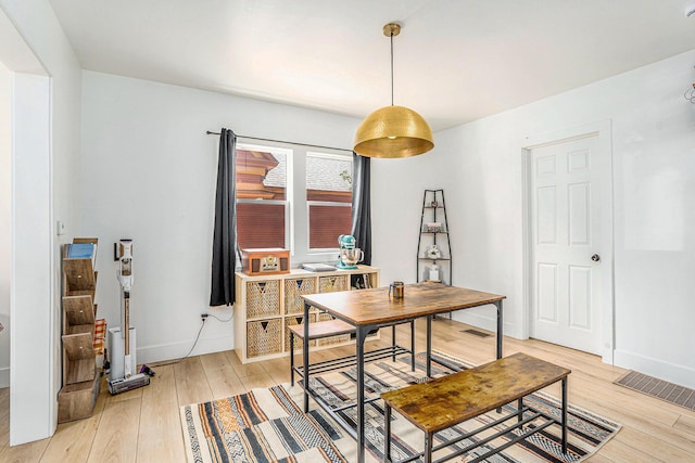1213 Prospect Ave SE, Grand Rapids, MI 49507 - dining room with light wood-style floors and a desk