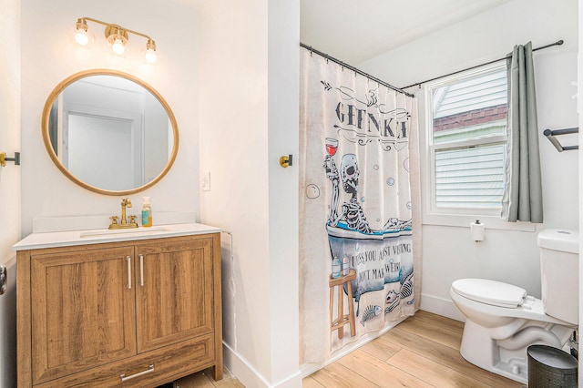 1213 Prospect Ave SE, Grand Rapids, MI 49507 - bathroom with vanity, wood finished floors, and a shower with curtain