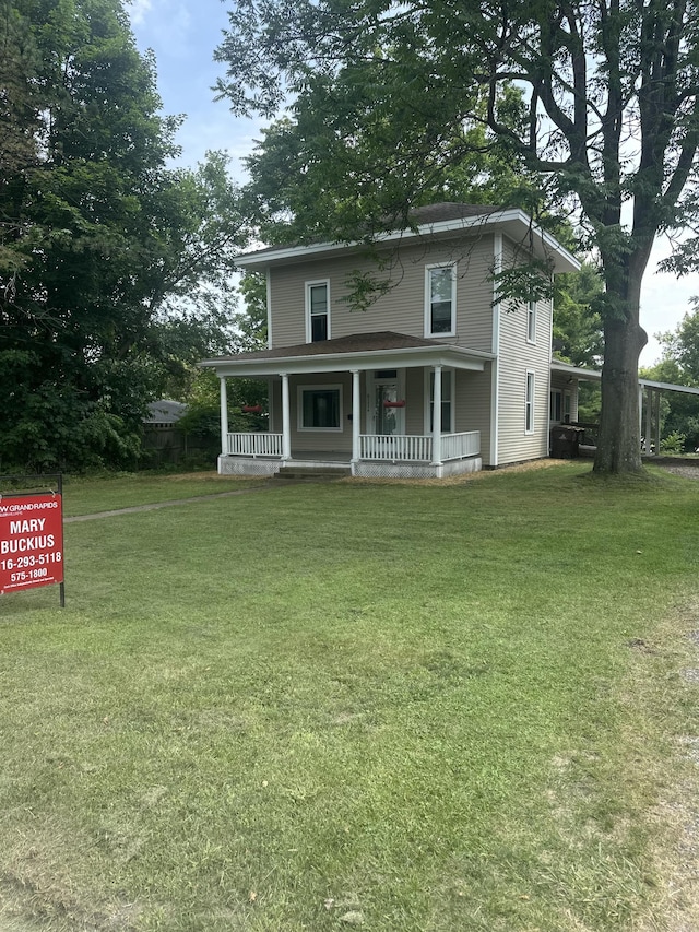 811 W Lincoln Ave, Ionia, MI 48846 - view of front of house featuring a porch and a front lawn