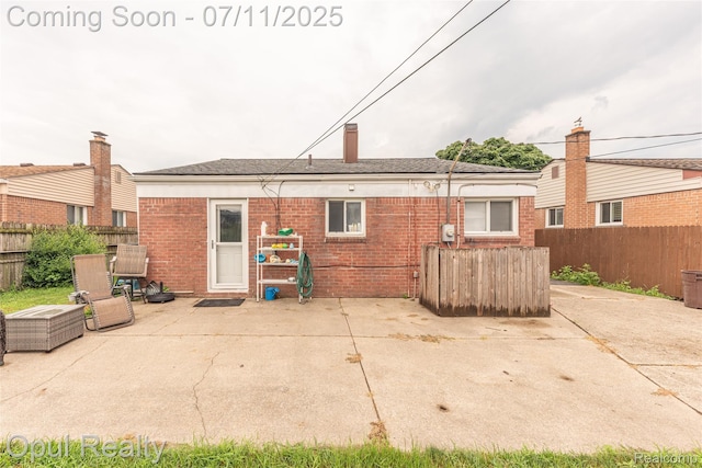 205 Shotka St, Westland, MI 48186 - back of house with a patio area and brick siding