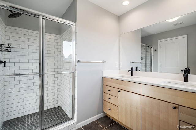 1087 Hampton Cir Unit 55, Detroit, MI 48207 - bathroom with a shower stall, double vanity, tile patterned flooring, and recessed lighting