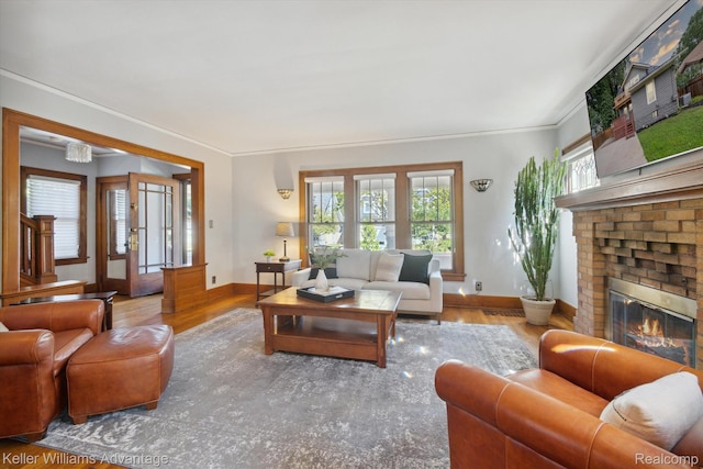 402 E 7th St, Royal Oak, MI 48067 - living room with wood finished floors, ornamental molding, and a fireplace
