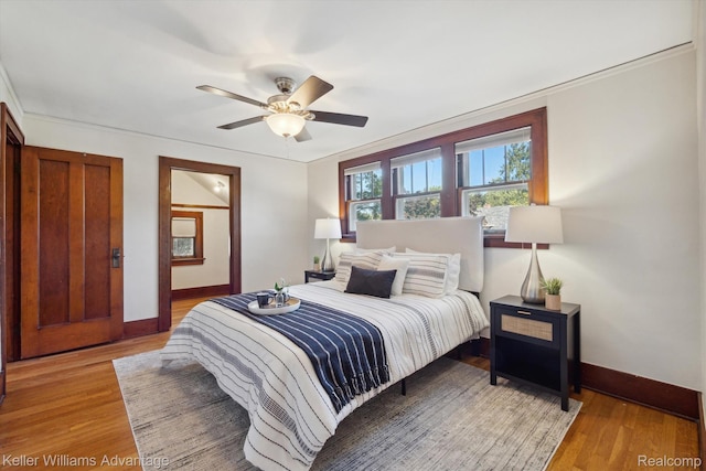 402 E 7th St, Royal Oak, MI 48067 - bedroom featuring light wood-style flooring and ceiling fan