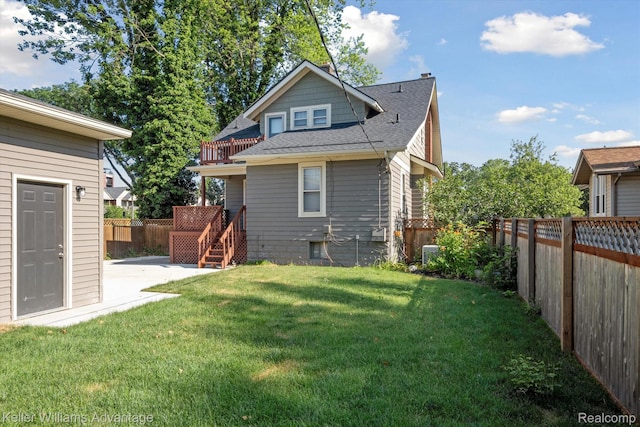 402 E 7th St, Royal Oak, MI 48067 - rear view of house with a shingled roof, a fenced backyard, and a patio