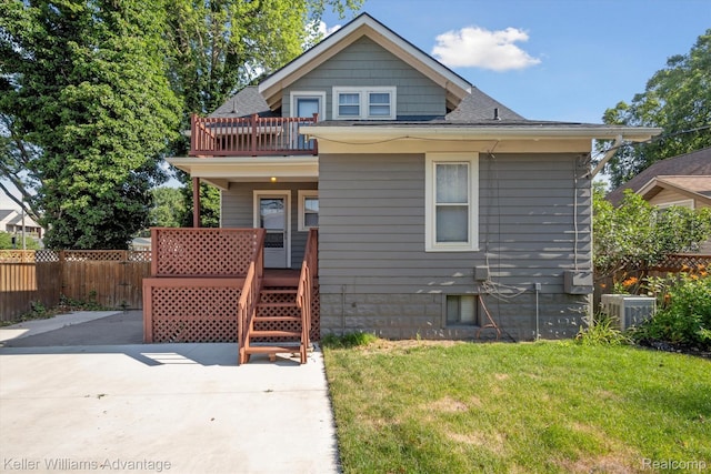 402 E 7th St, Royal Oak, MI 48067 - view of front of house featuring roof with shingles, a balcony, and covered porch