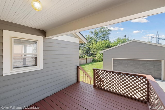 402 E 7th St, Royal Oak, MI 48067 - wooden terrace featuring an outbuilding, a detached garage, and a lawn