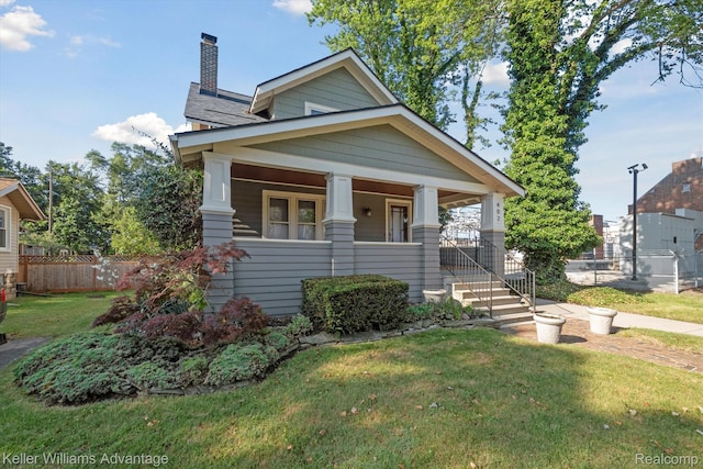 402 E 7th St, Royal Oak, MI 48067 - craftsman-style home featuring a porch and a chimney