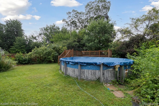 402 E 7th St, Royal Oak, MI 48067 - view of grassy yard featuring a deck and a covered pool