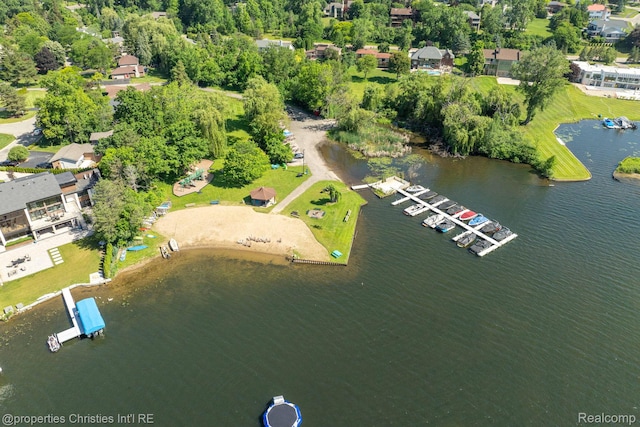 4768 Wendrick Dr, West Bloomfield, MI 48323 - aerial view of property and surrounding area with a nearby body of water and a tree filled landscape