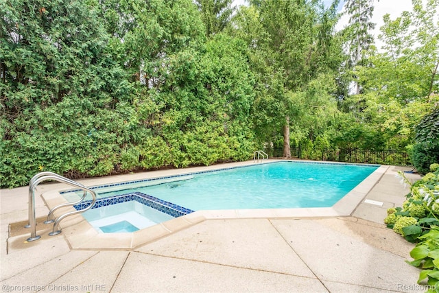 4768 Wendrick Dr, West Bloomfield, MI 48323 - view of swimming pool with a pool with connected hot tub and a patio area