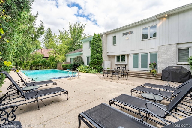 4768 Wendrick Dr, West Bloomfield, MI 48323 - view of pool with area for grilling, a patio area, and french doors