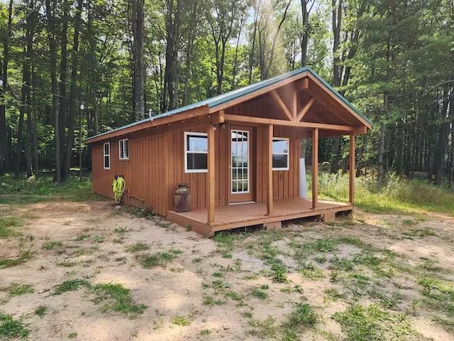 2599 N Pine Ave, White Cloud, MI 49349 - view of outbuilding with a view of trees