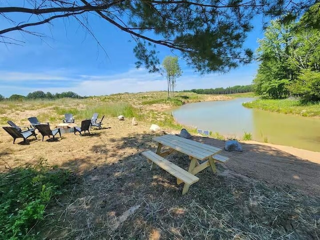 2599 N Pine Ave, White Cloud, MI 49349 - view of community featuring a water view and a fire pit