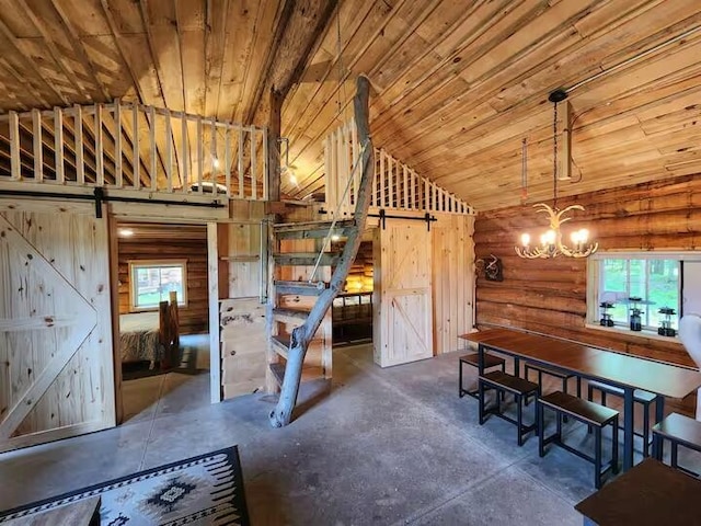 2599 N Pine Ave, White Cloud, MI 49349 - dining room featuring a barn door, lofted ceiling, concrete floors, a chandelier, and wood ceiling