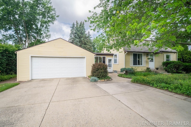 4001 Hillsdale Ave NE, Grand Rapids, MI 49525 - view of front facade featuring concrete driveway and an attached garage