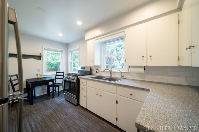 4001 Hillsdale Ave NE, Grand Rapids, MI 49525 - kitchen featuring gas range, dark wood finished floors, tasteful backsplash, recessed lighting, and light countertops