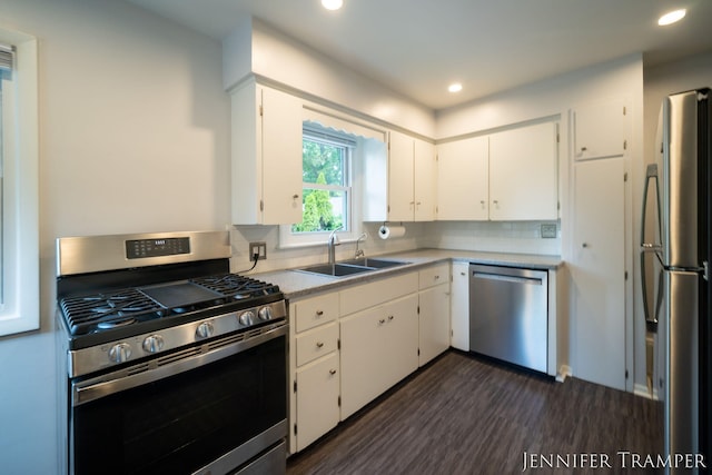 4001 Hillsdale Ave NE, Grand Rapids, MI 49525 - kitchen featuring stainless steel appliances, white cabinetry, recessed lighting, light countertops, and dark wood-type flooring