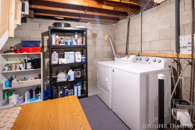 4001 Hillsdale Ave NE, Grand Rapids, MI 49525 - laundry room featuring washer and clothes dryer and concrete block wall
